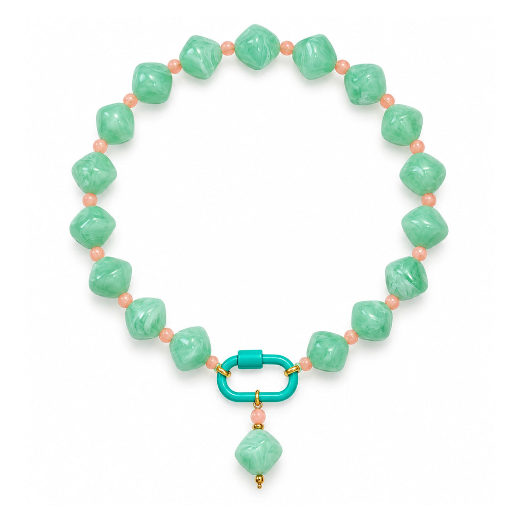 Mint green with peach accents acrylic beaded necklace with a mint-green rounded diamond pendant on a white background.