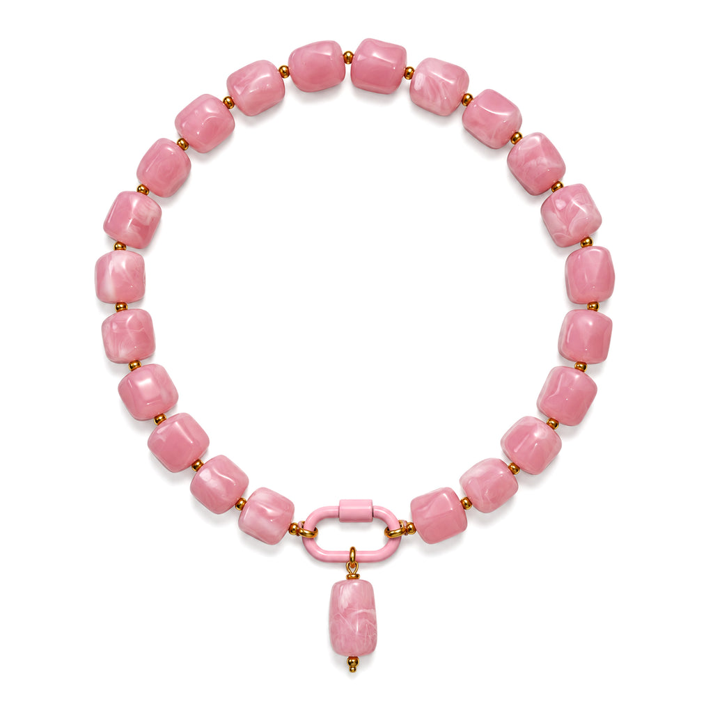 Pink acrylic beaded necklace with a pink oval pendant on a white background.