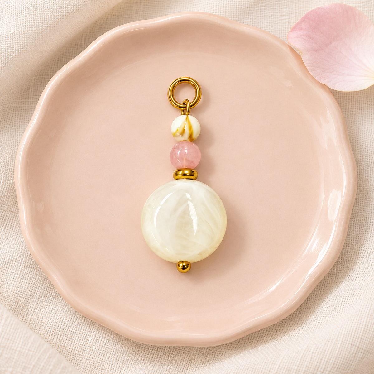 Cream and Pink Beaded Acrylic Pendant styled on a neutral background
