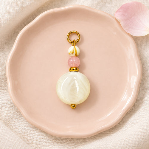 Cream and Pink Beaded Acrylic Pendant styled on a neutral background