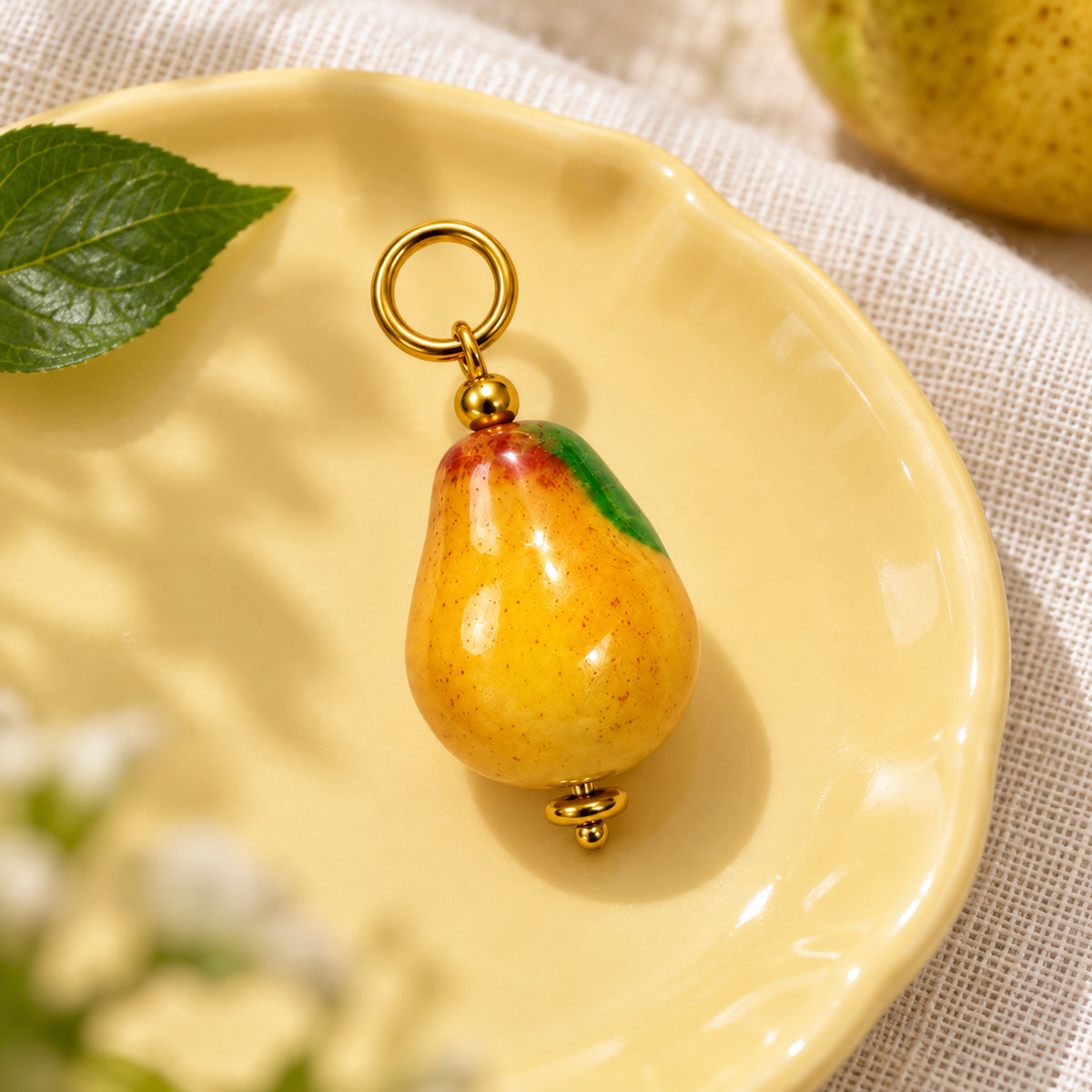 Golden Yellow Pear Acrylic Pendant styled on a neutral background
