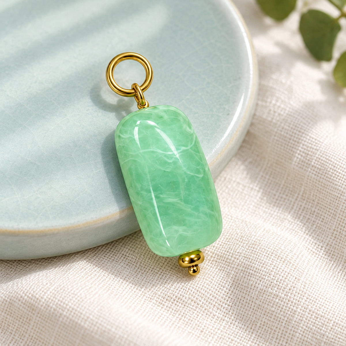 Mint Green Oval Acrylic Pendant styled on a neutral background