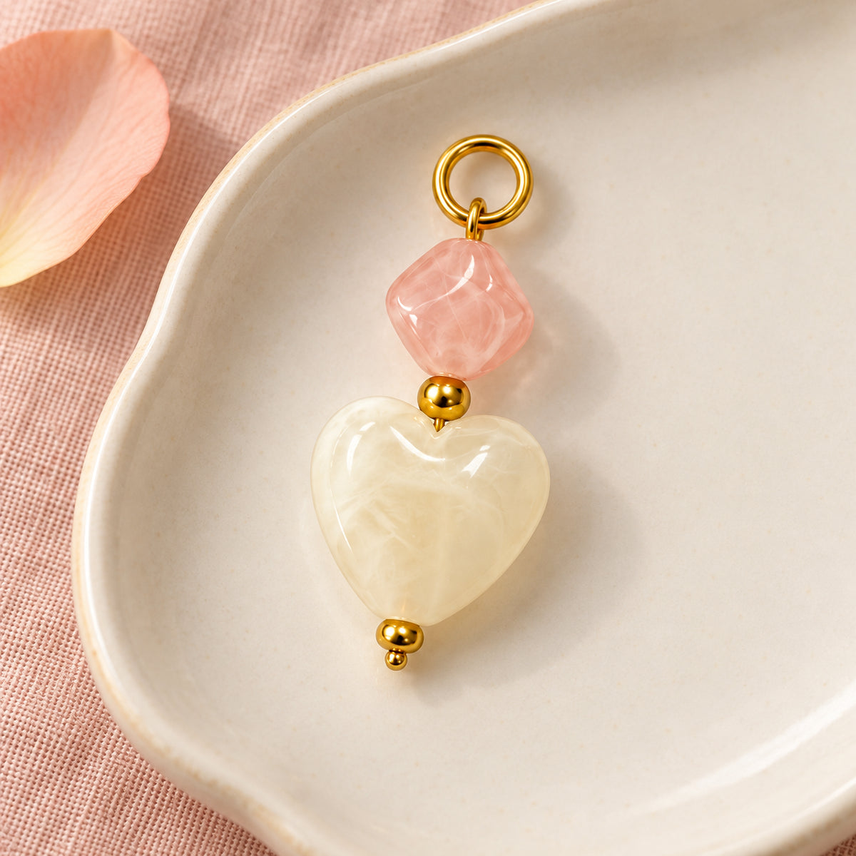 Pink and Cream Heart Acrylic Pendant styled on a neutral background