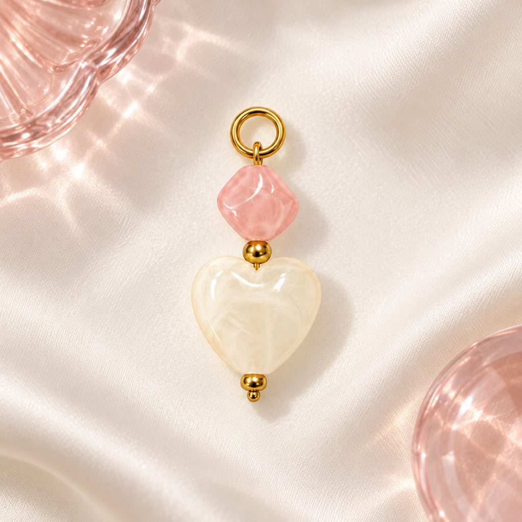 Pink and Cream Heart Acrylic Pendant styled on a neutral background