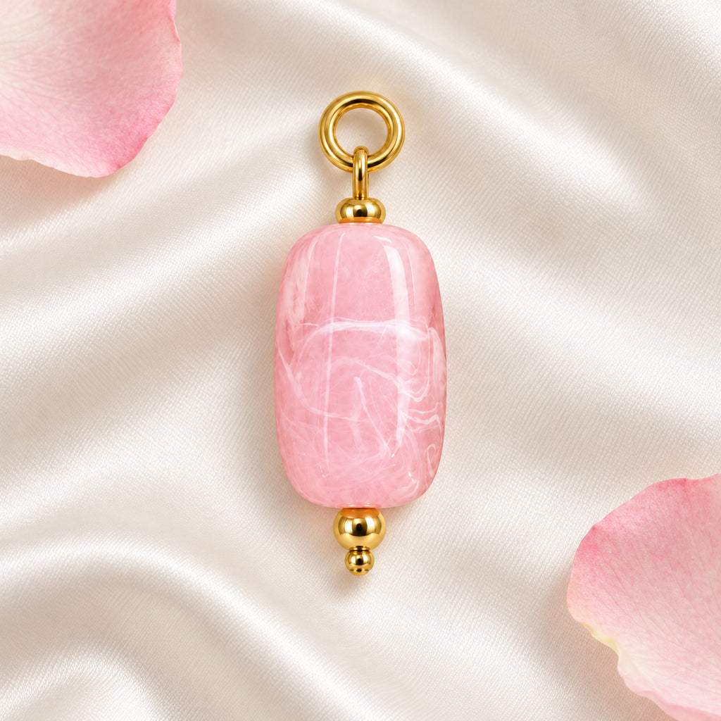 Pink Oval Acrylic Pendant styled on a neutral background