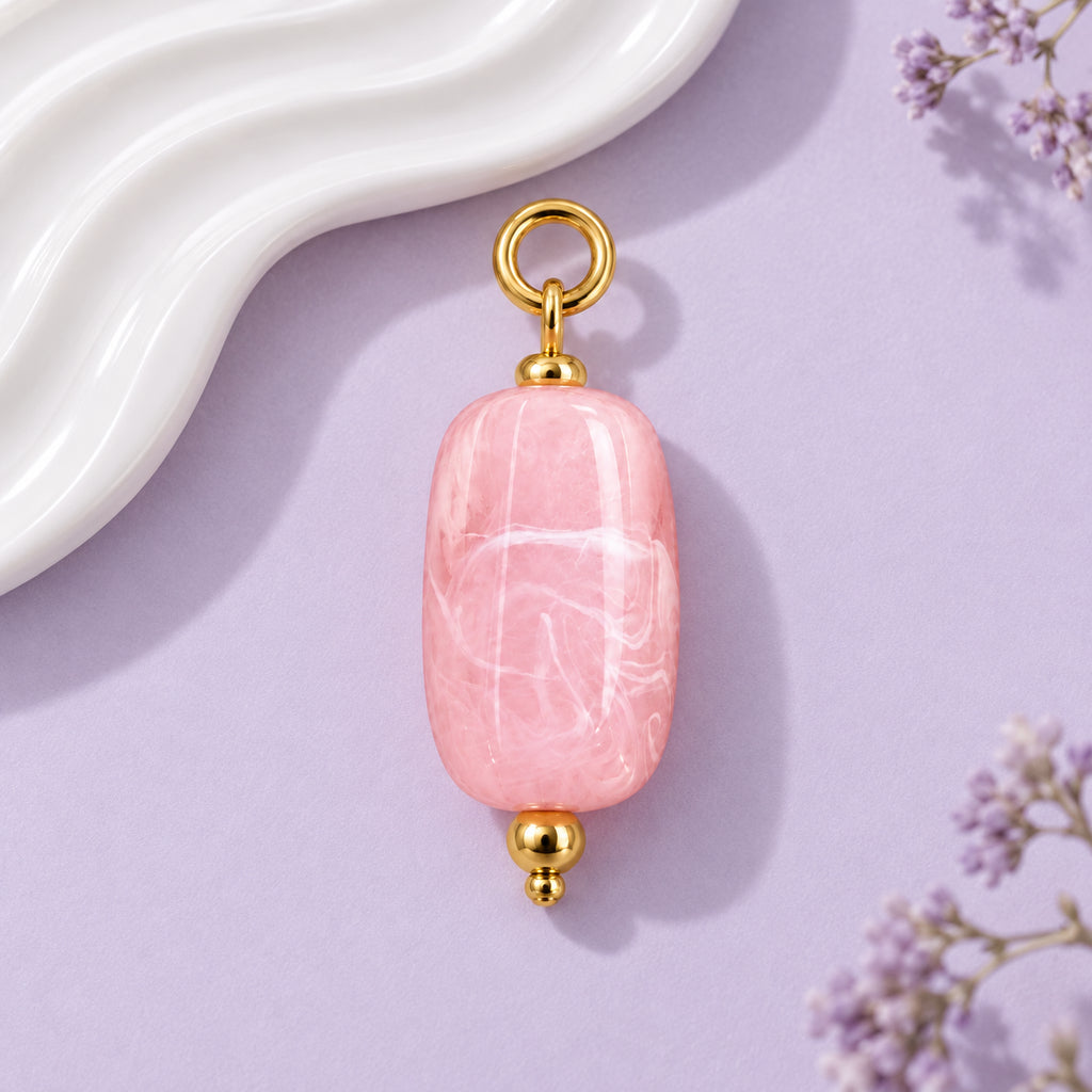Pink Oval Acrylic Pendant styled on a neutral background