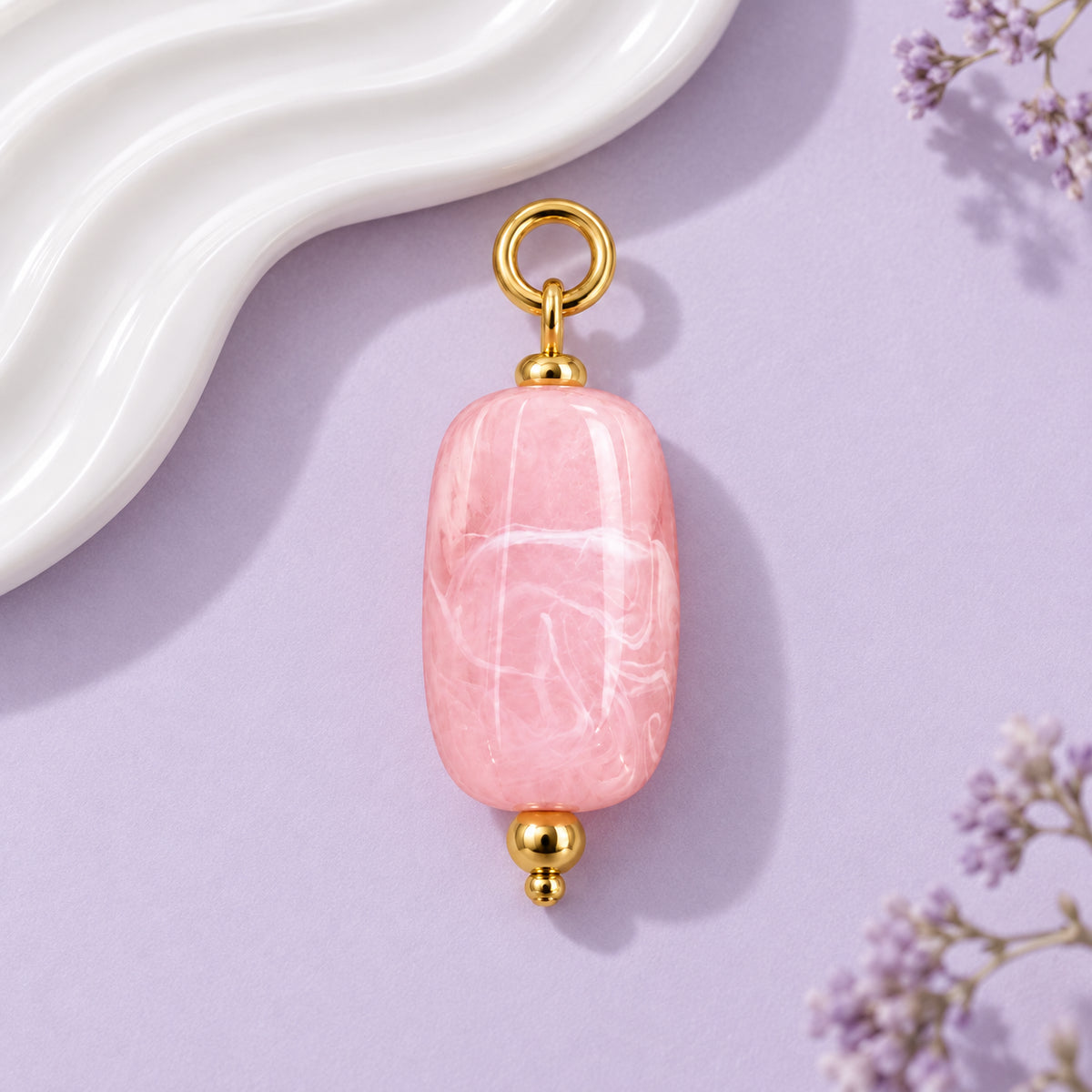 Pink Oval Acrylic Pendant styled on a neutral background