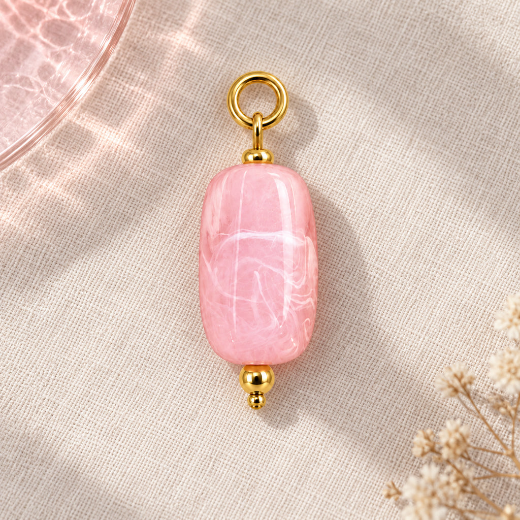 Pink Oval Acrylic Pendant styled on a neutral background