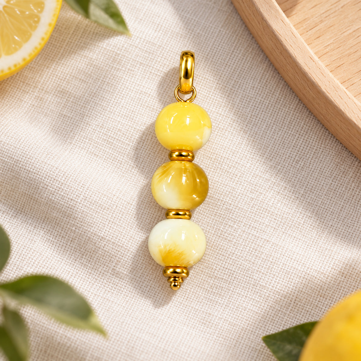 Yellow and Cream Beaded Acrylic Pendant styled on a neutral background